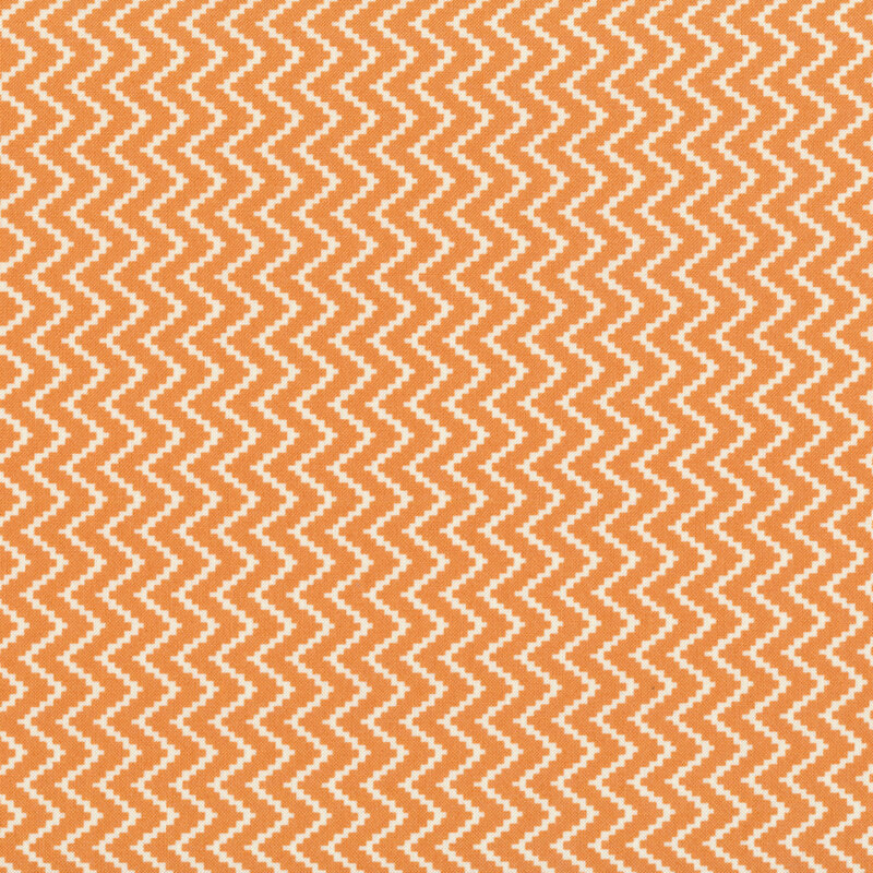 Fabric features cream pixelated zig zag on orange background | Shabby Fabrics