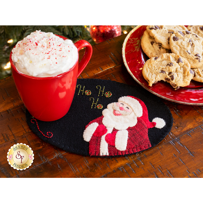 The adorable December Wooly Mut Mat displayed with a glass of milk and cookies | Shabby Fabrics