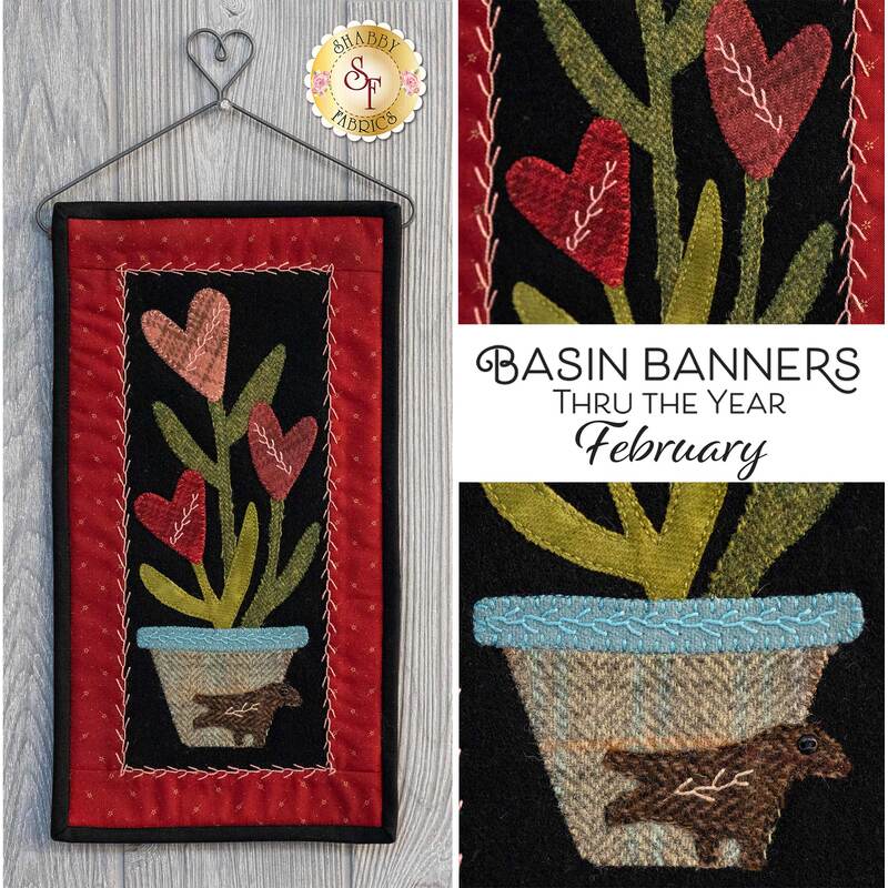 The finished Basin Banners Thru The Year - February wall hanging displayed on a craft holder