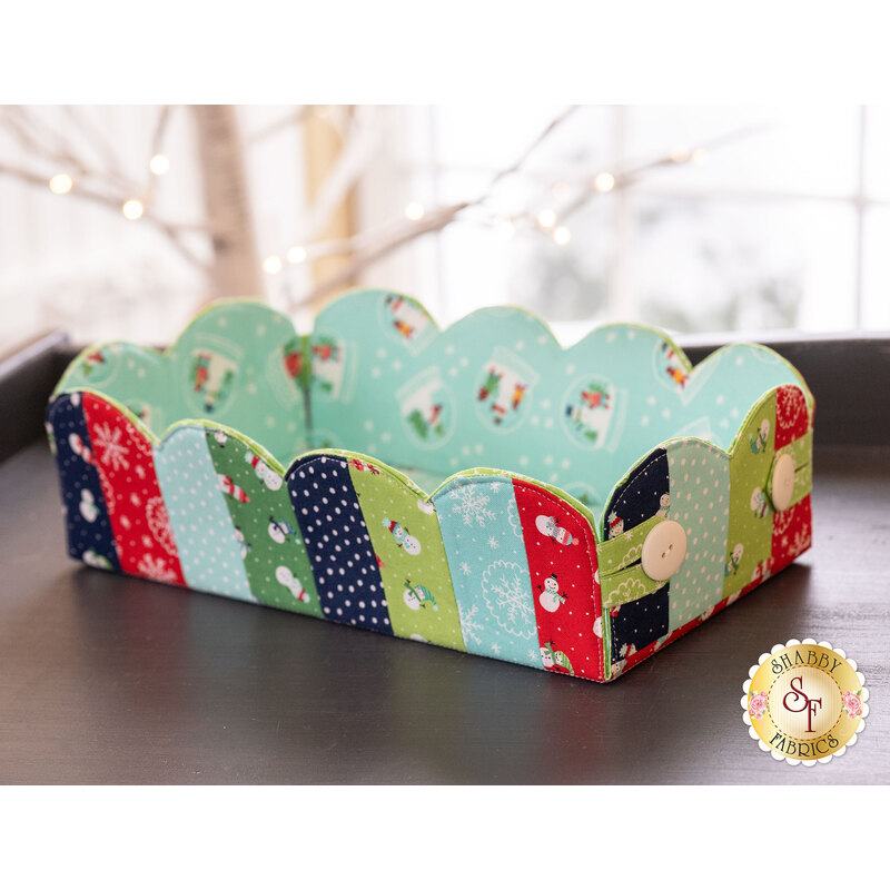 The Snow Day Scalloped Basket displayed on a table