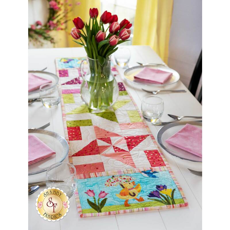 The adorable March Easy Pieced Table Runner displayed on a set table
