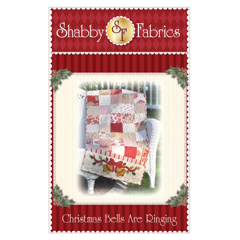 The front of the Christmas Bells are Ringing Pattern by Shabby Fabrics showing the finished table runner with a patchwork center and appliqued bells with holly & berries at each end.