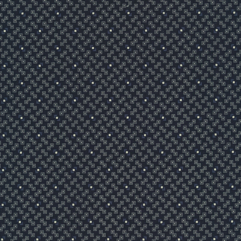 Fabric features tiny cream and blue geometric pattern on navy | Shabby Fabrics