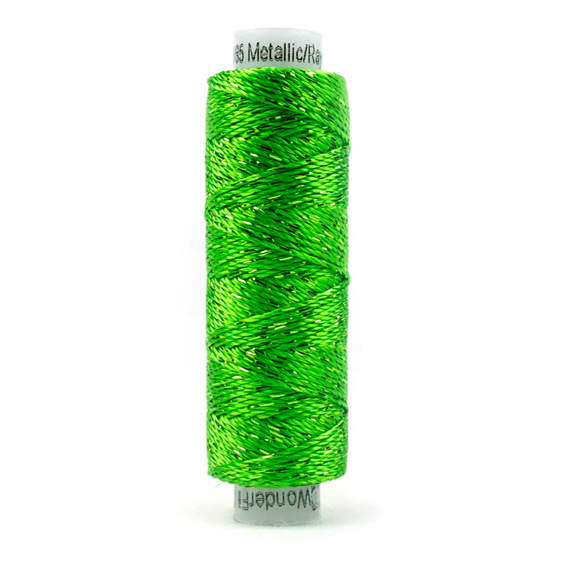 A spool of WonderFil Dazzle 4110 - Classic Green thread on a white background