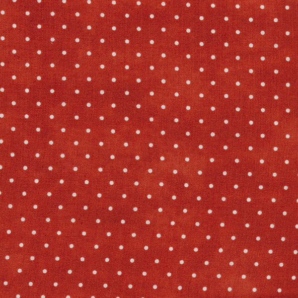 Fabric features tiny cream polka dots on mottled red | Shabby Fabrics