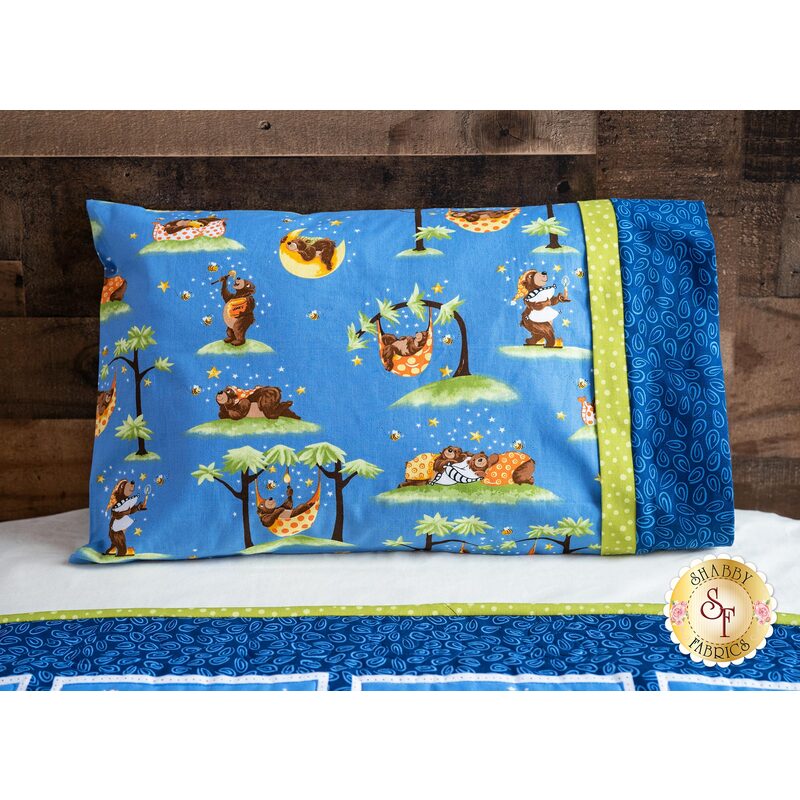 The adorable Barron the Bear Travel Pillowcase displayed on a bed | Shabby Fabrics