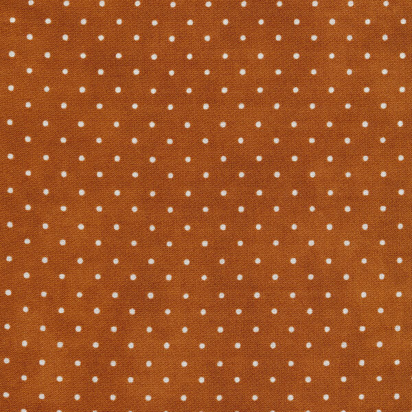 Fabric features tiny cream polka dots on burnt orange | Shabby Fabrics