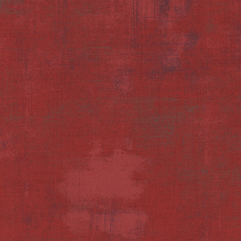 Dark red grunge textured fabric