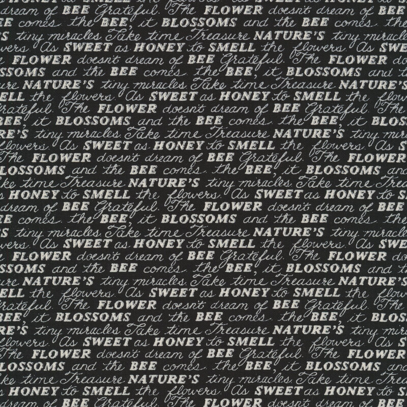 Fabric features cream conversational word script on black | Shabby Fabrics