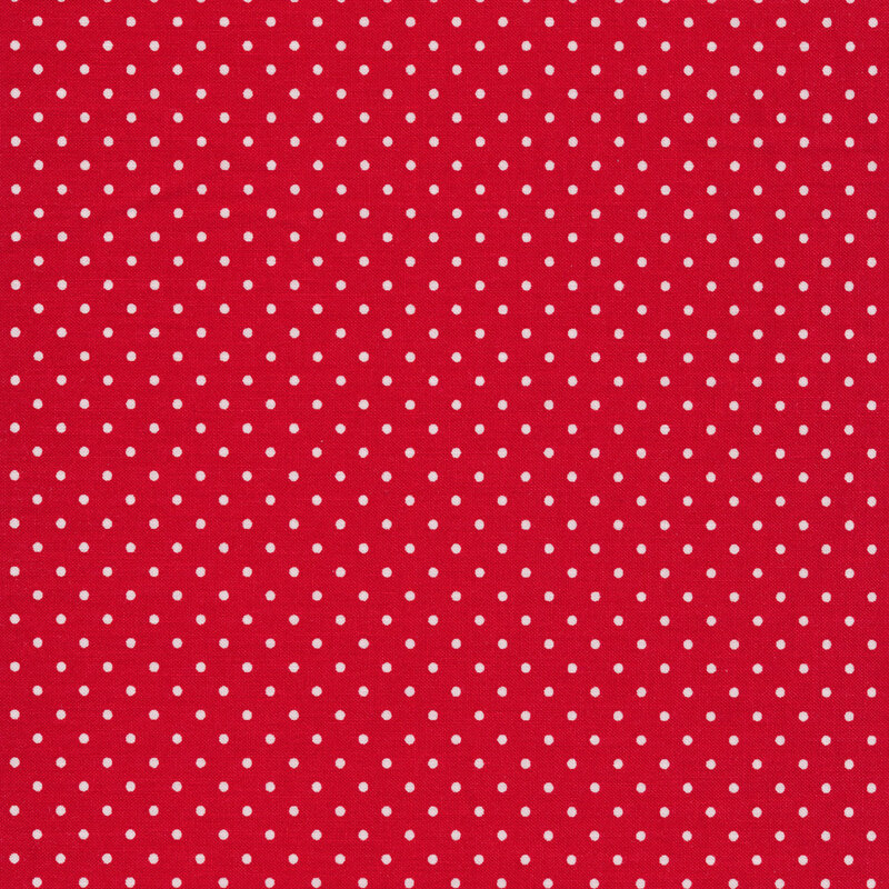 Fabric with small white polka dots all over a red background