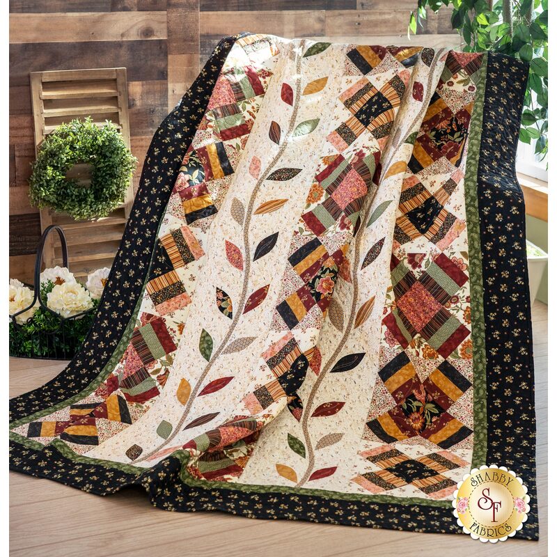 The stunning On The Road To Tarrington Quilt draped over a chair | Shabby Fabrics