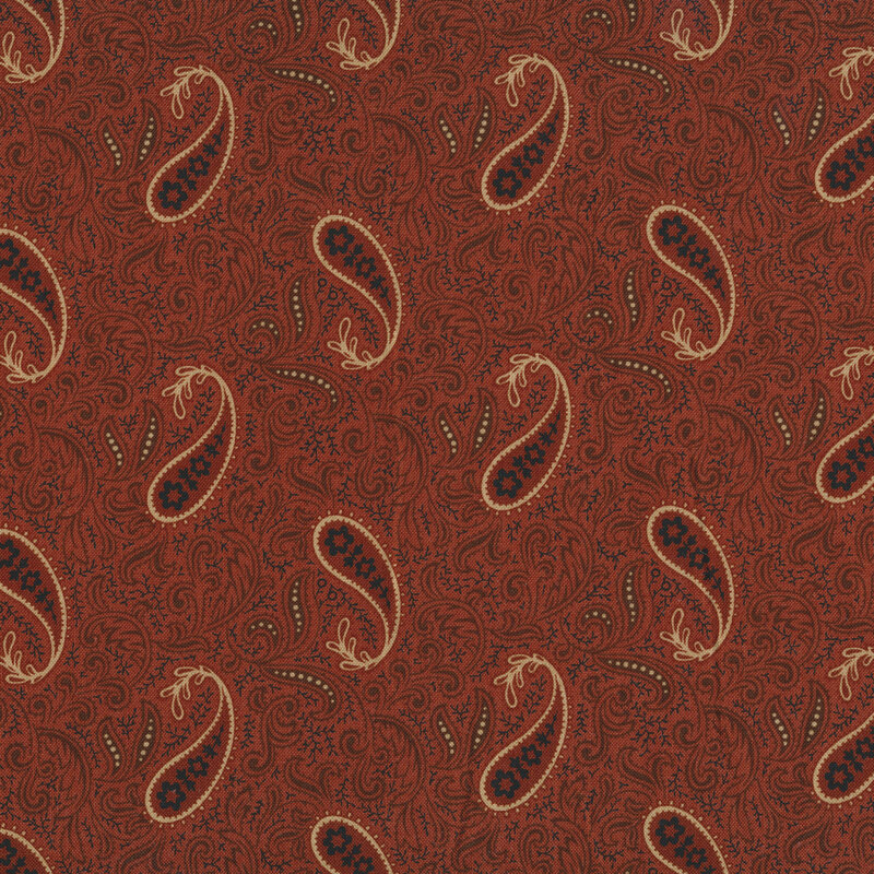 Fabric features intricate red blue cream paisley design on red | Shabby Fabrics