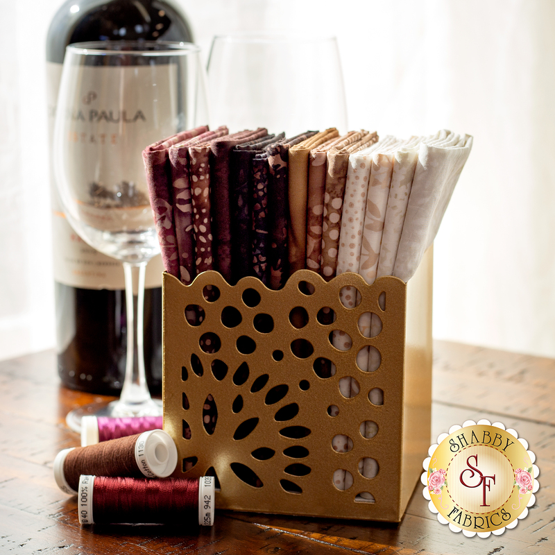 A Bali Batiks Bordeaux Bliss FQ Set displayed in a cute gold box