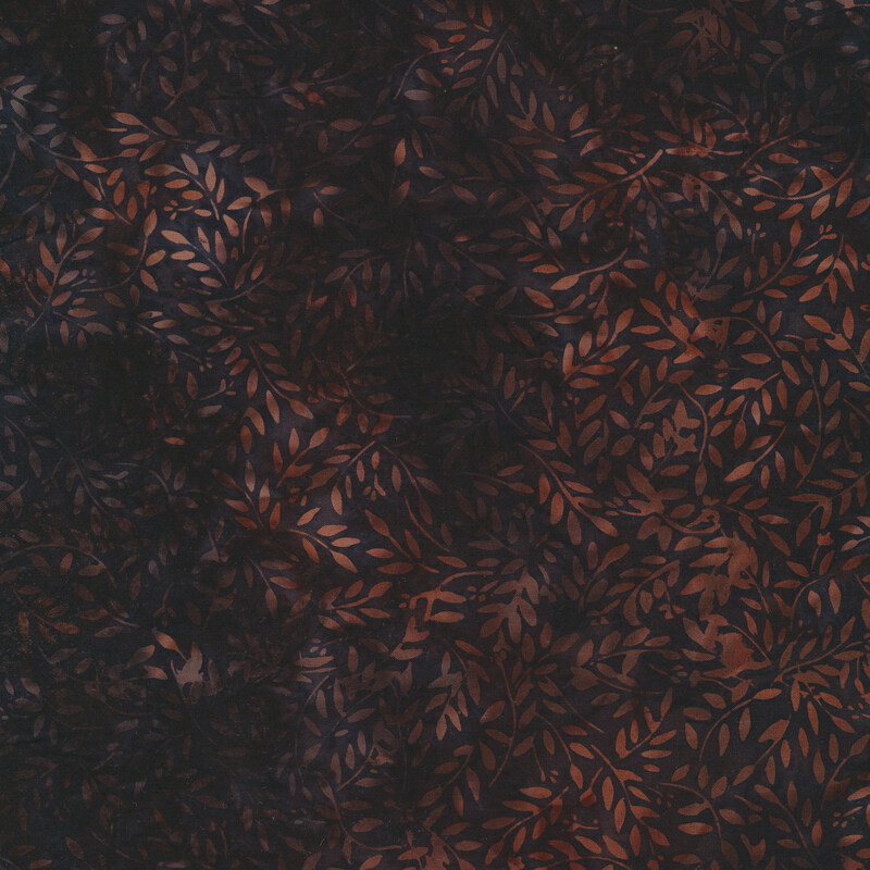 Batik fabric features orange tonal ditsy flowers on maroon | Shabby Fabrics