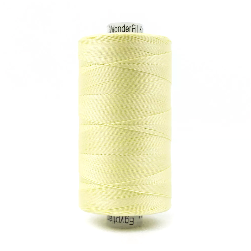 A spool of Konfetti KT405 - Pale Yellow thread on a white background