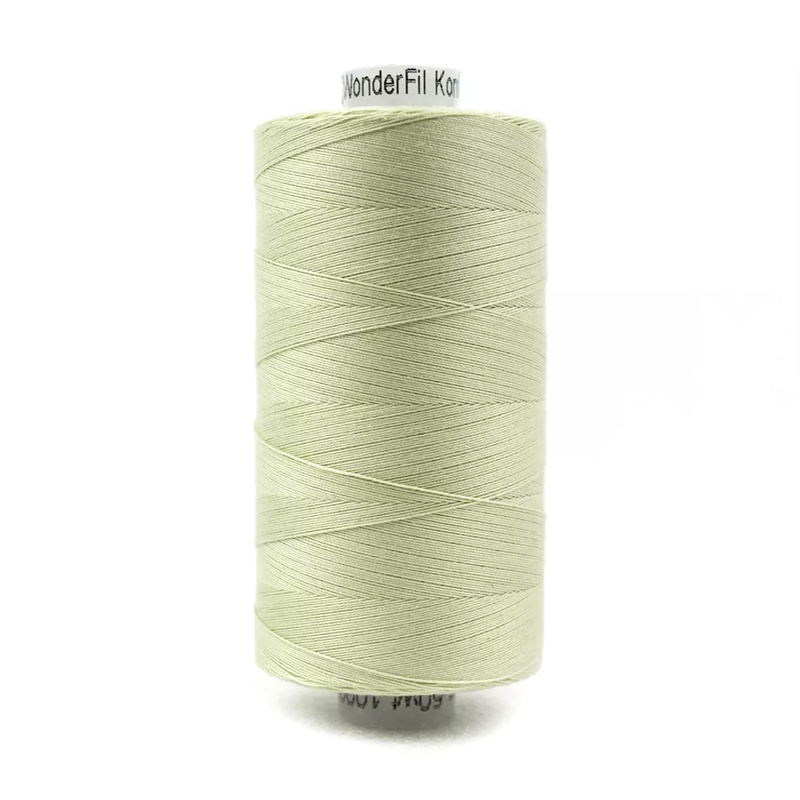 A spool of Konfetti KT700 - Light Sage Green thread on a white background