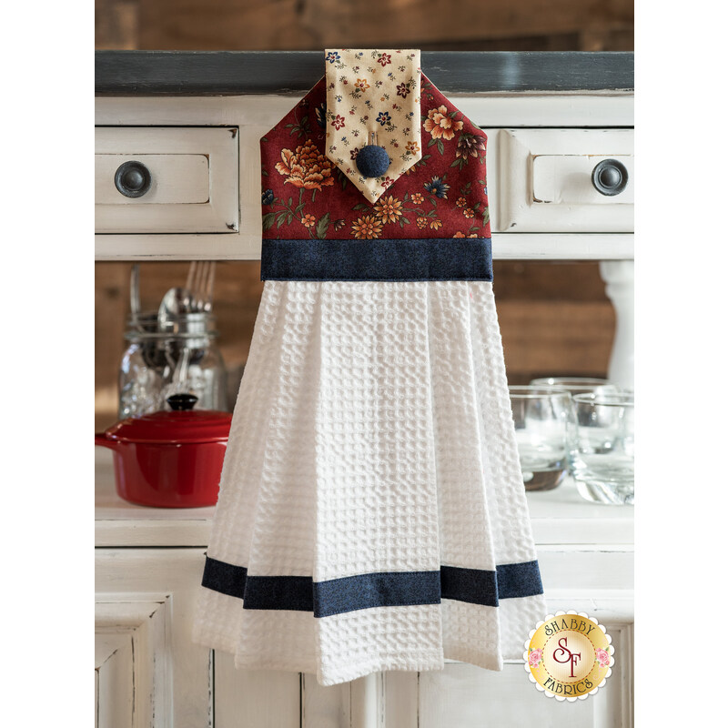 The Through the Years Hanging Towel displayed in front of a cabinet | Shabby Fabrics