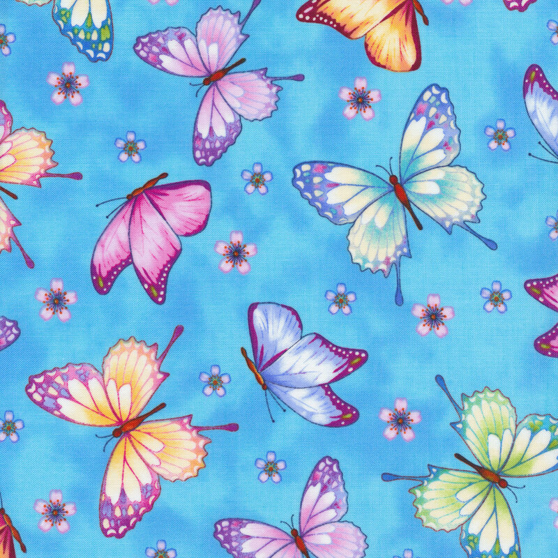 Bright mottled blue fabric features tossed colorful butterflies and small flowers | Shabby Fabrics