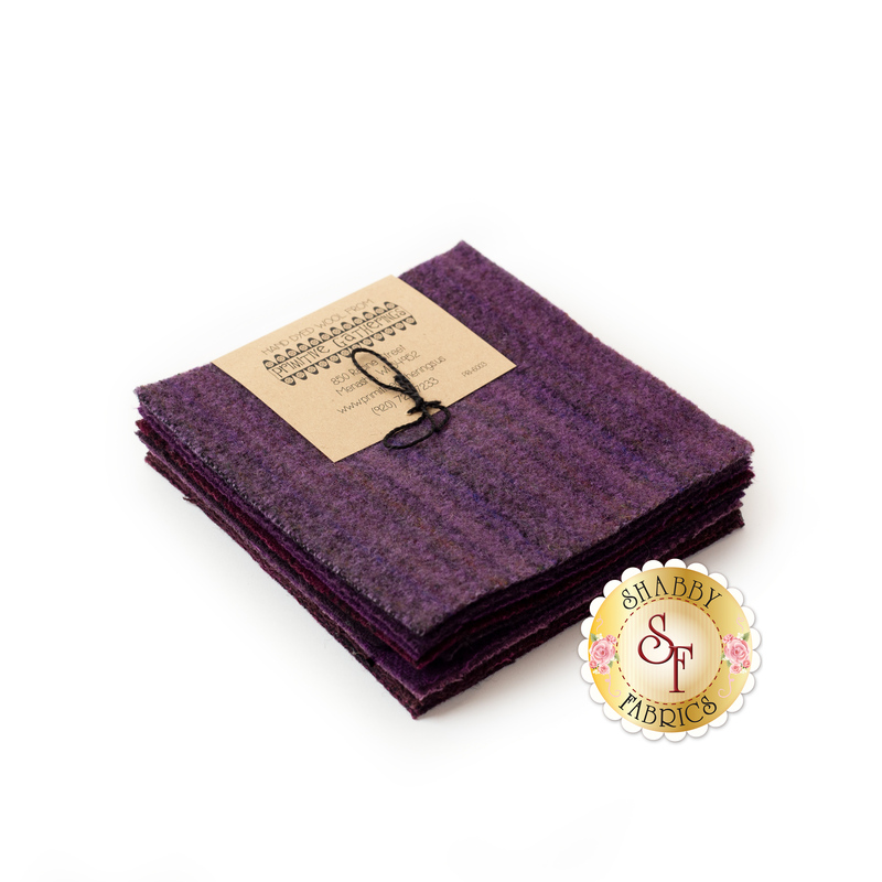 A set of 5" purple Wool squares stacked with a cute label