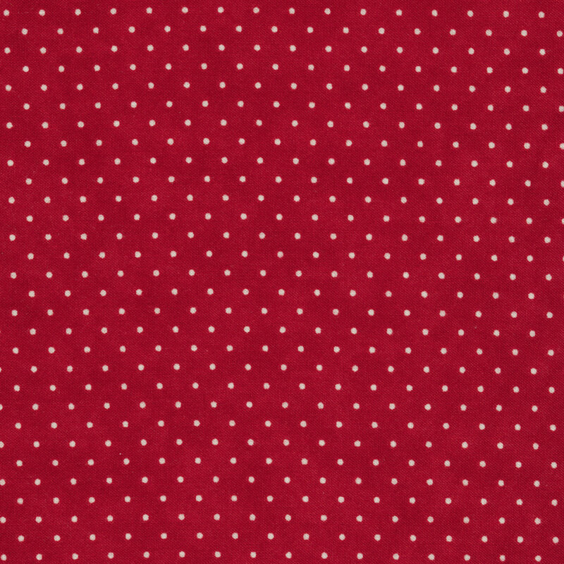 This Moda fabric features a country red background with off white polka dots
