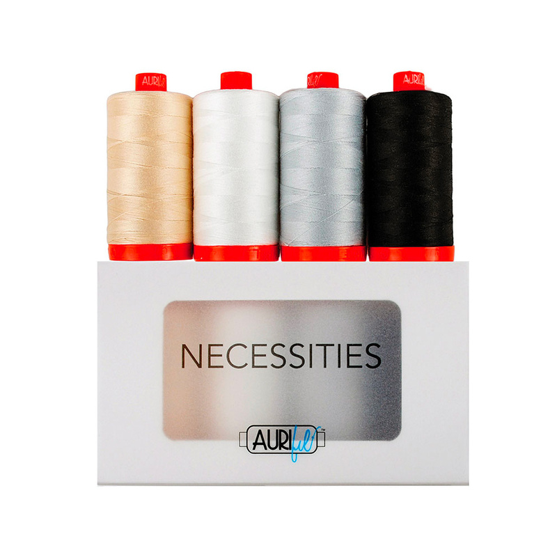 4 neutral thread sets on top of the Aurifil Necessities Thread Set Box