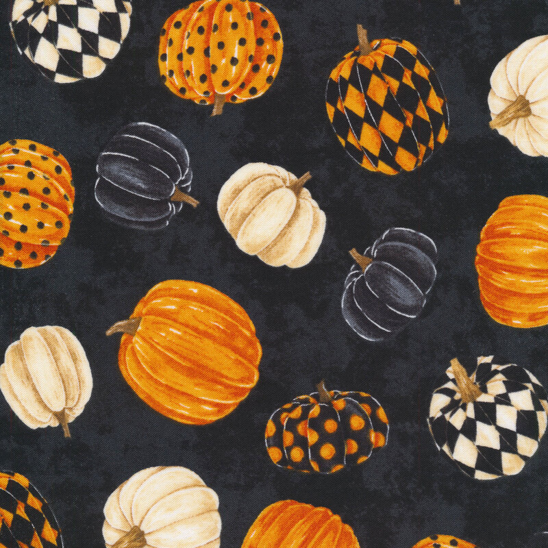 Fabric features tossed patterned pumpkins in cream orange black on mottled black | Shabby Fabrics