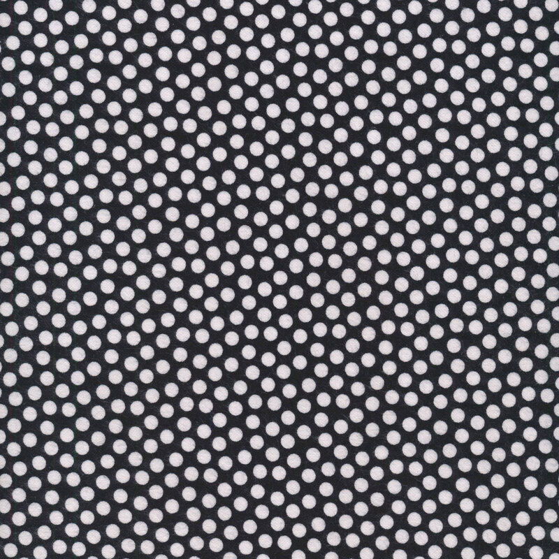White polka dots all over a black background