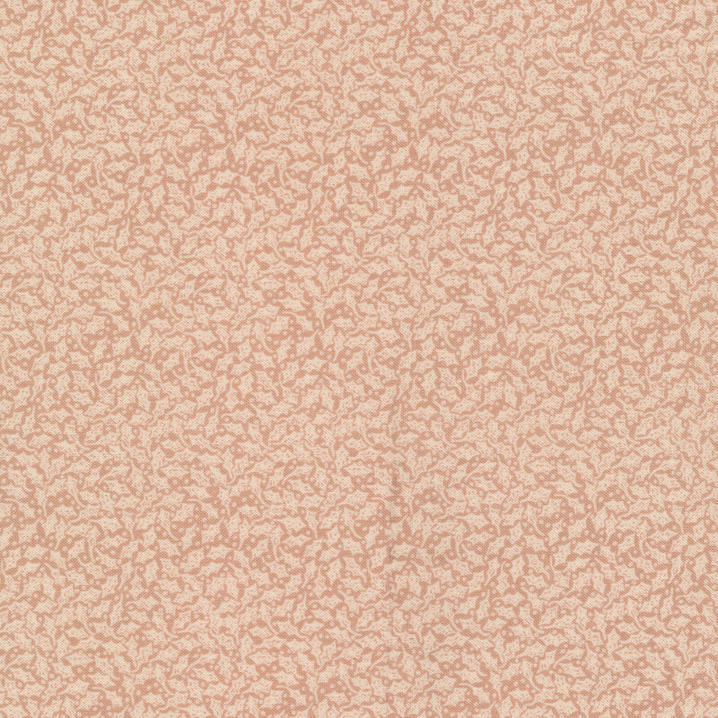 Fabric features primitive cream holly leaf design on light red clay background | Shabby Fabrics
