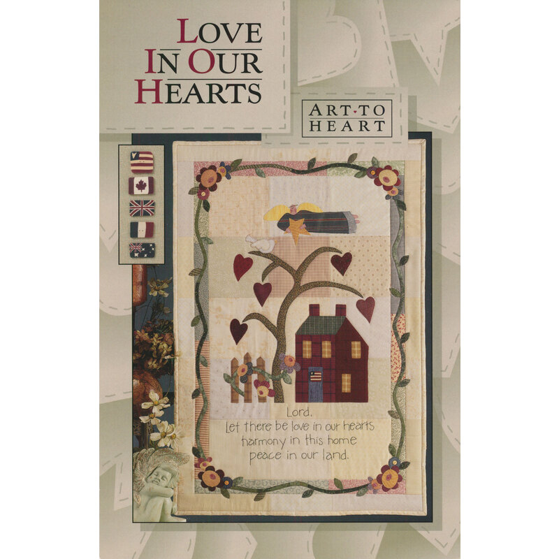 The front of the Love In Our Hearts pattern by Art to Heart featuring a home surrounded by a cute heart tree
