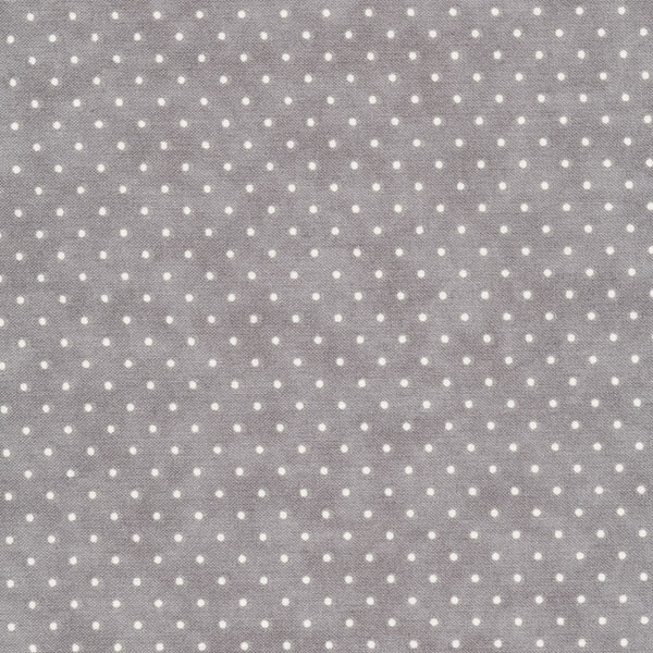 This Moda fabric features a gray background with off white polka dots