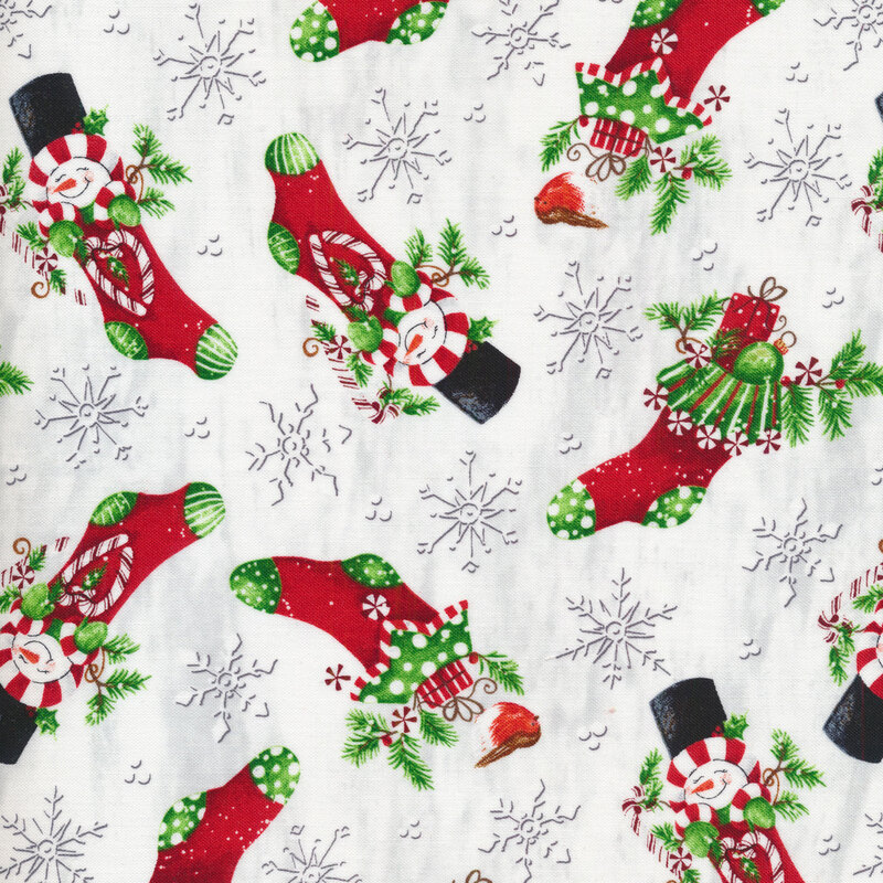 Tossed Christmas stockings full of snowmen and candy canes on a white background