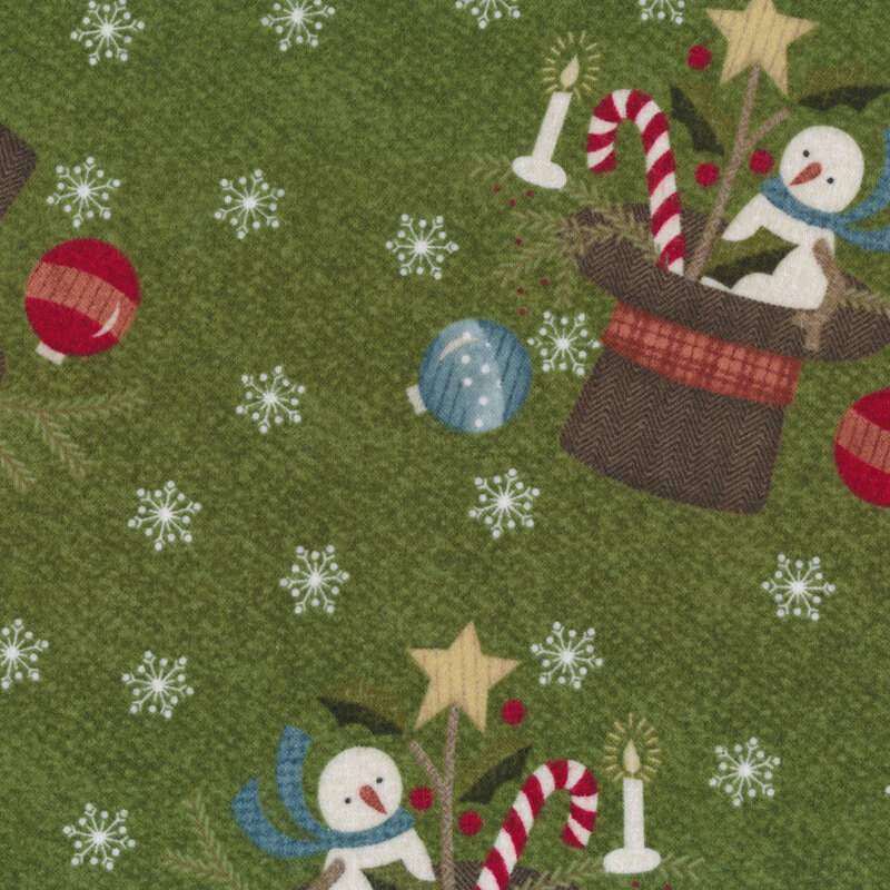 Tossed snowmen in top hats and snowflakes all over green | Shabby Fabrics