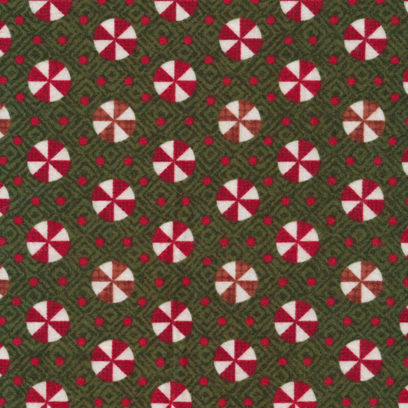 Tossed red and white peppermint candy on textured green | Shabby Fabrics