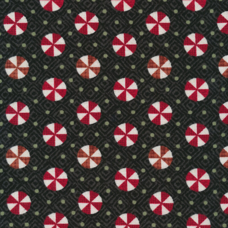 Tossed red and white peppermint candy on textured black | Shabby Fabrics